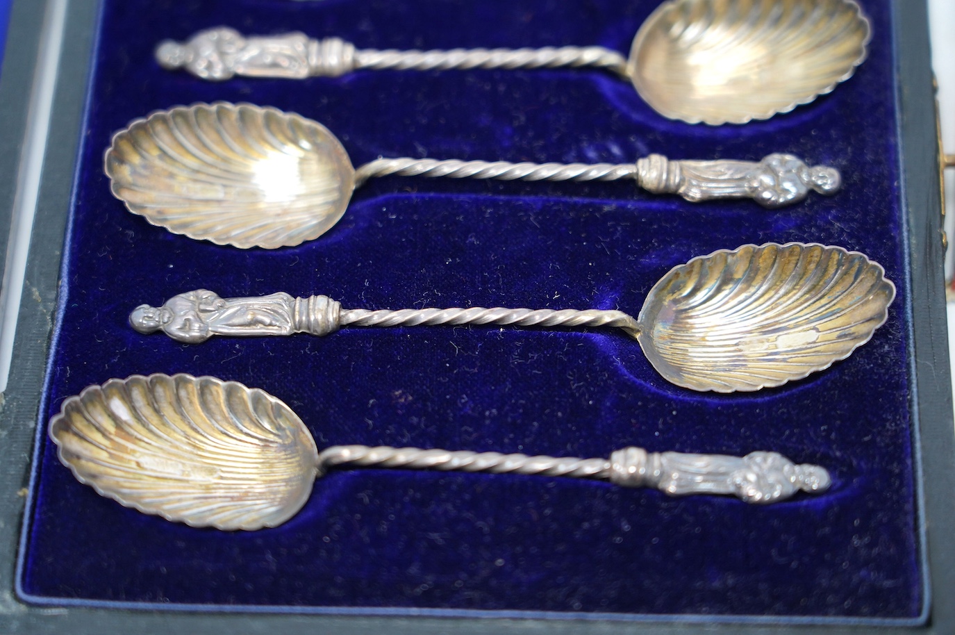 A cased set of six silver apostle coffee spoons and a small quantity of assorted mainly costume jewellery. Condition - poor to fair